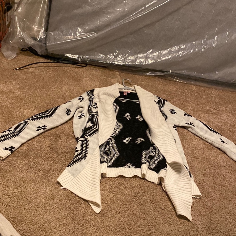 White sweater with black design